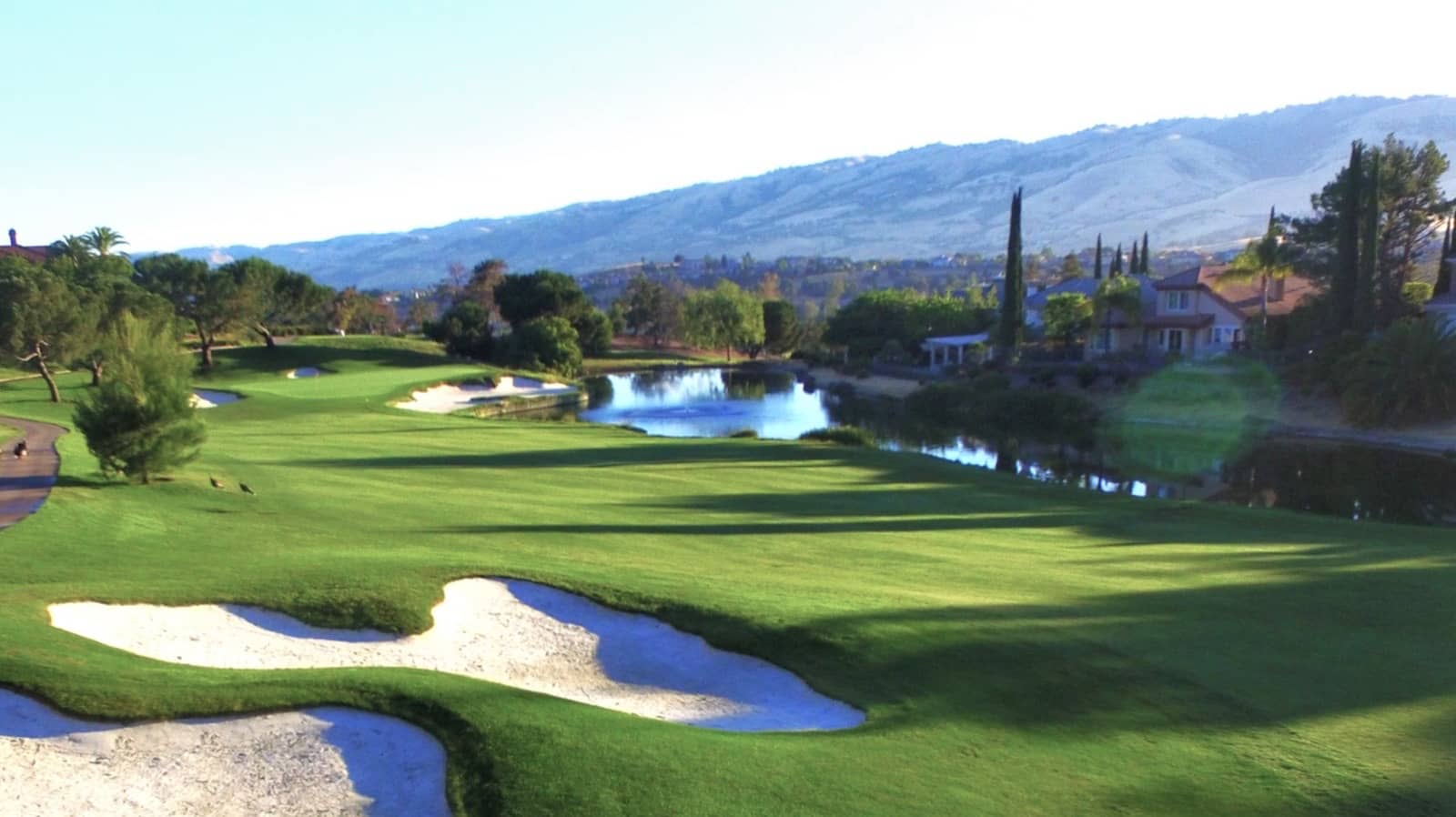 A fairway, bunkers, and lake at Silver Creek Valley Country Club in San Jose.