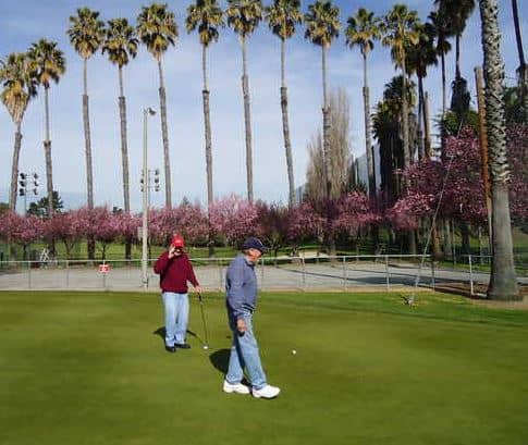 Golfers putting at Sunken Gardens Golf Course in Sunnyvale.