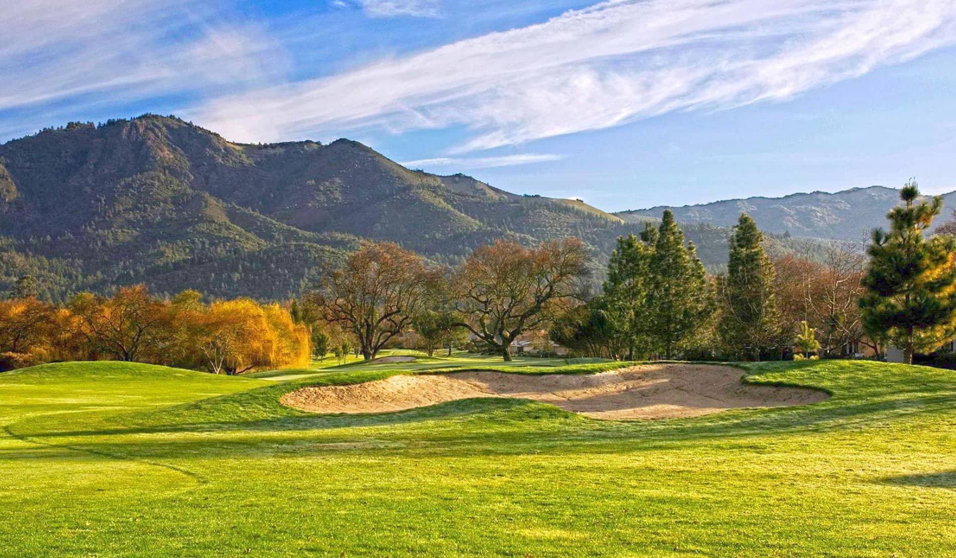 Greenside bunkers and rolling fairway on the West / Valley of the Moon course at Oakmont Golf Club, Santa Rosa, CA, with autumn foliage and the Sonoma mountains behind. Photo courtesy of Valley of the Moon Club (official website, playvom.com).