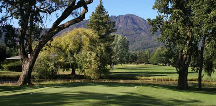 The par-63 Sugarloaf (East) executive course at Oakmont Golf Club in Santa Rosa, CA, framed by heritage oaks and the hills of Annadel State Park. Photo credit: Sonoma County Golf / Oakmont Golf Club (sonomacountygolf.com).